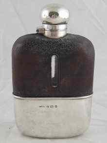 Appraisal: A silver mounted leather cased hip flask with cup Birmingham