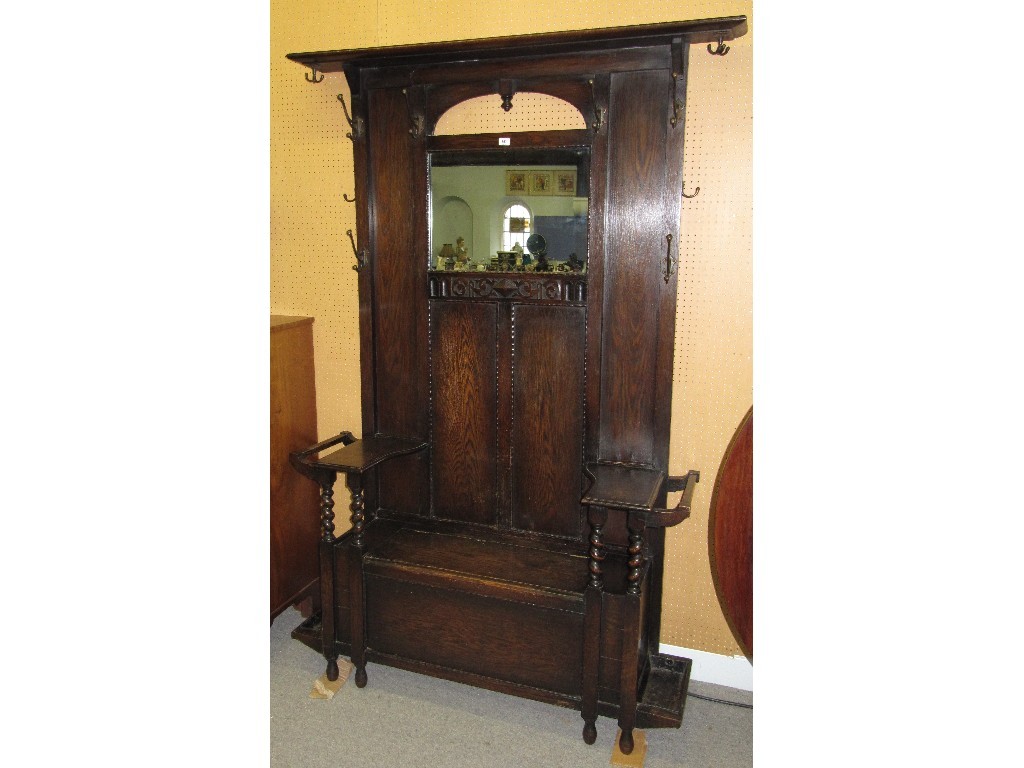 Appraisal: Carved oak mirror back hall stand