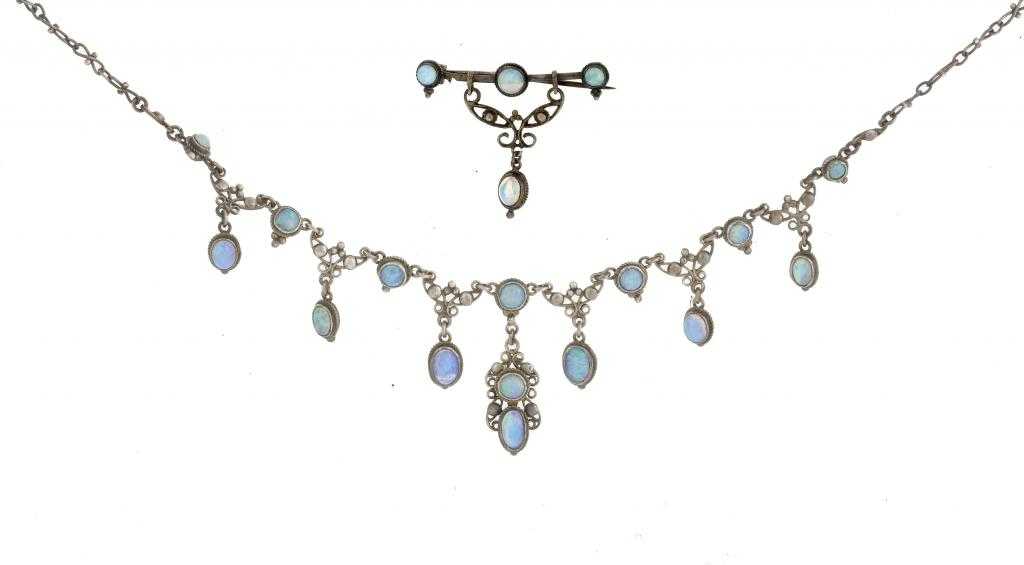 Appraisal: AN ARTS AND CRAFTS MOVEMENT OPAL SET NECKLET AND BROOCH