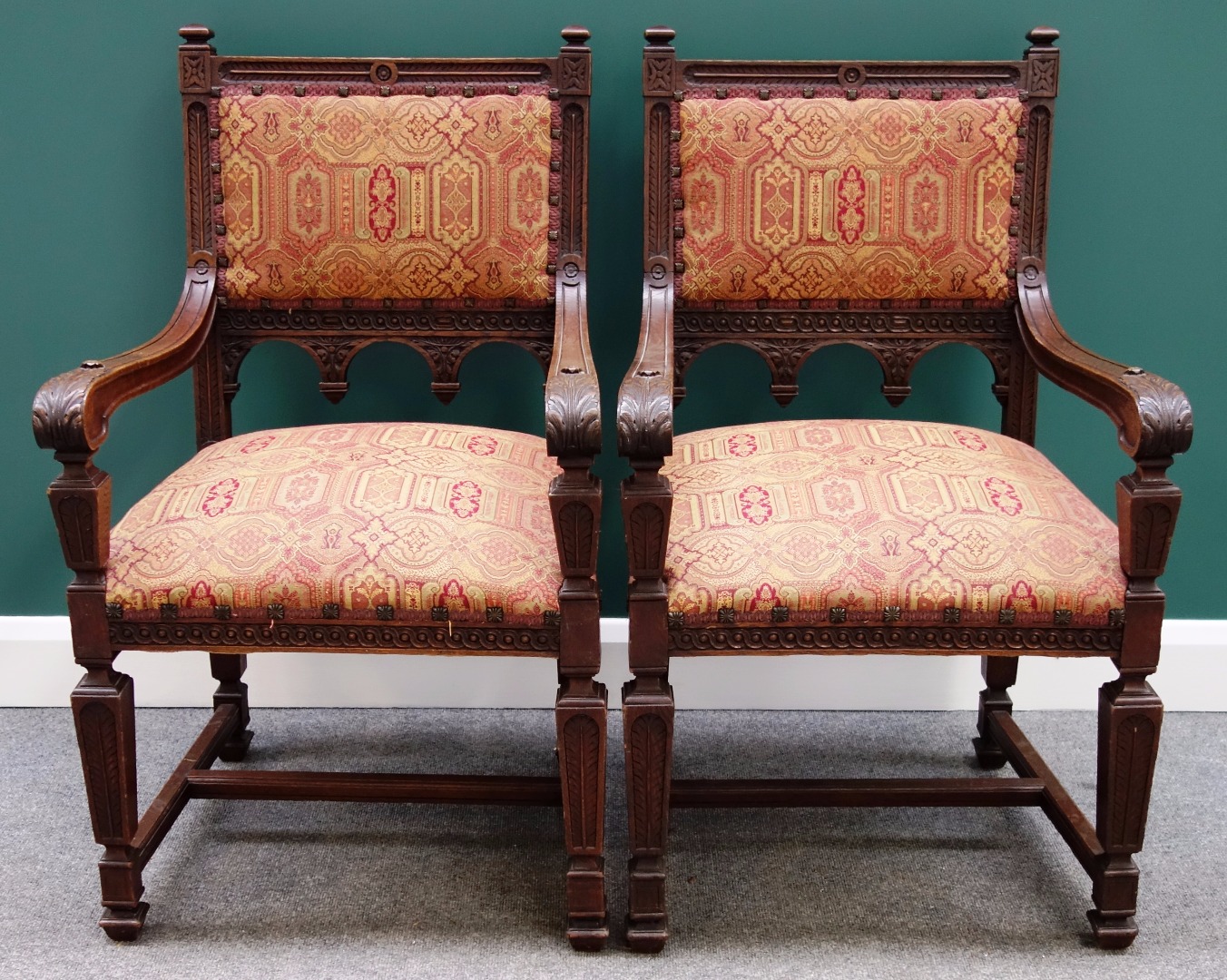 Appraisal: A pair of Victorian carved oak square back open armchairs