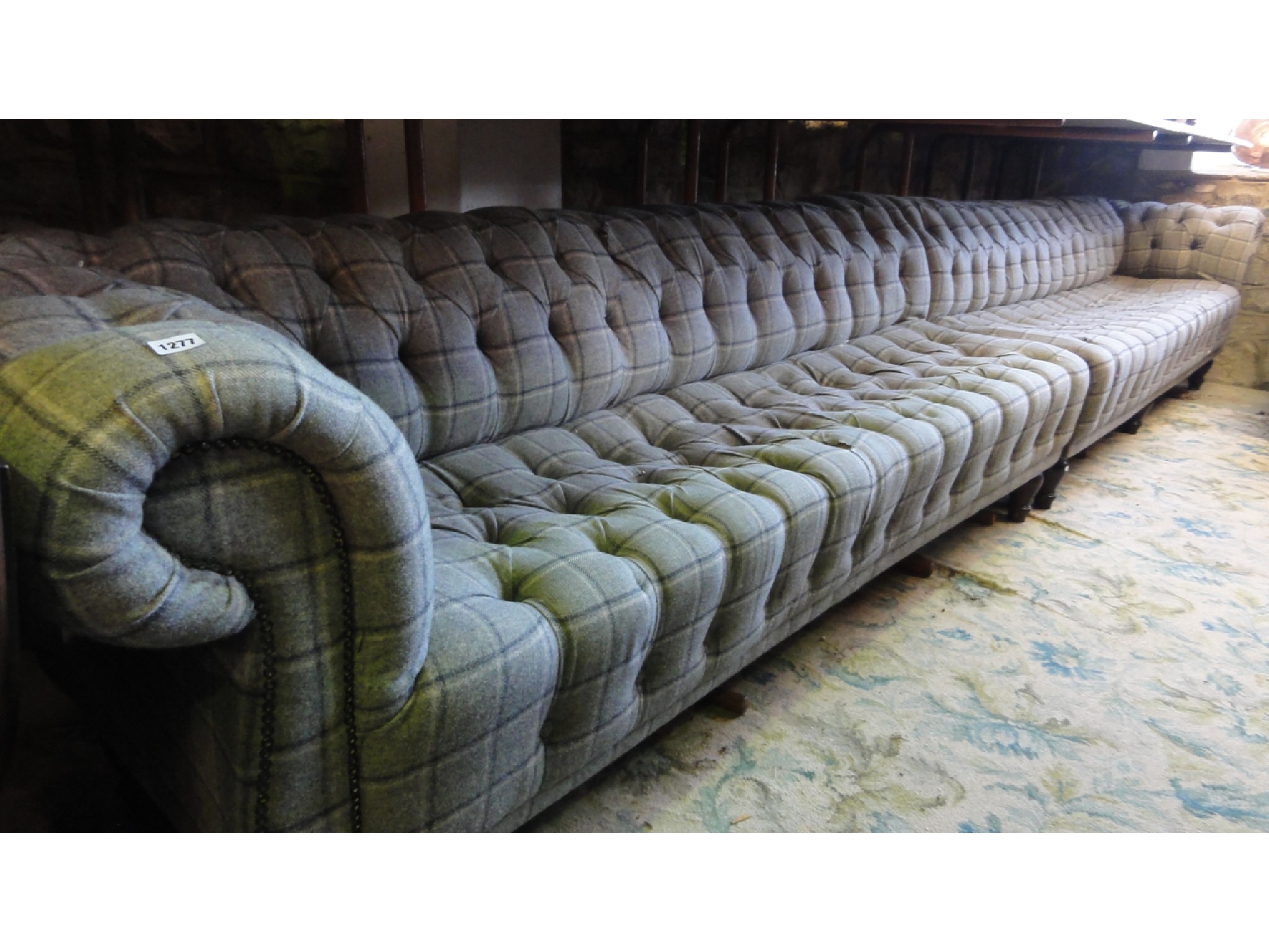 Appraisal: A contemporary long and narrow two sectional Chesterfield type sofa