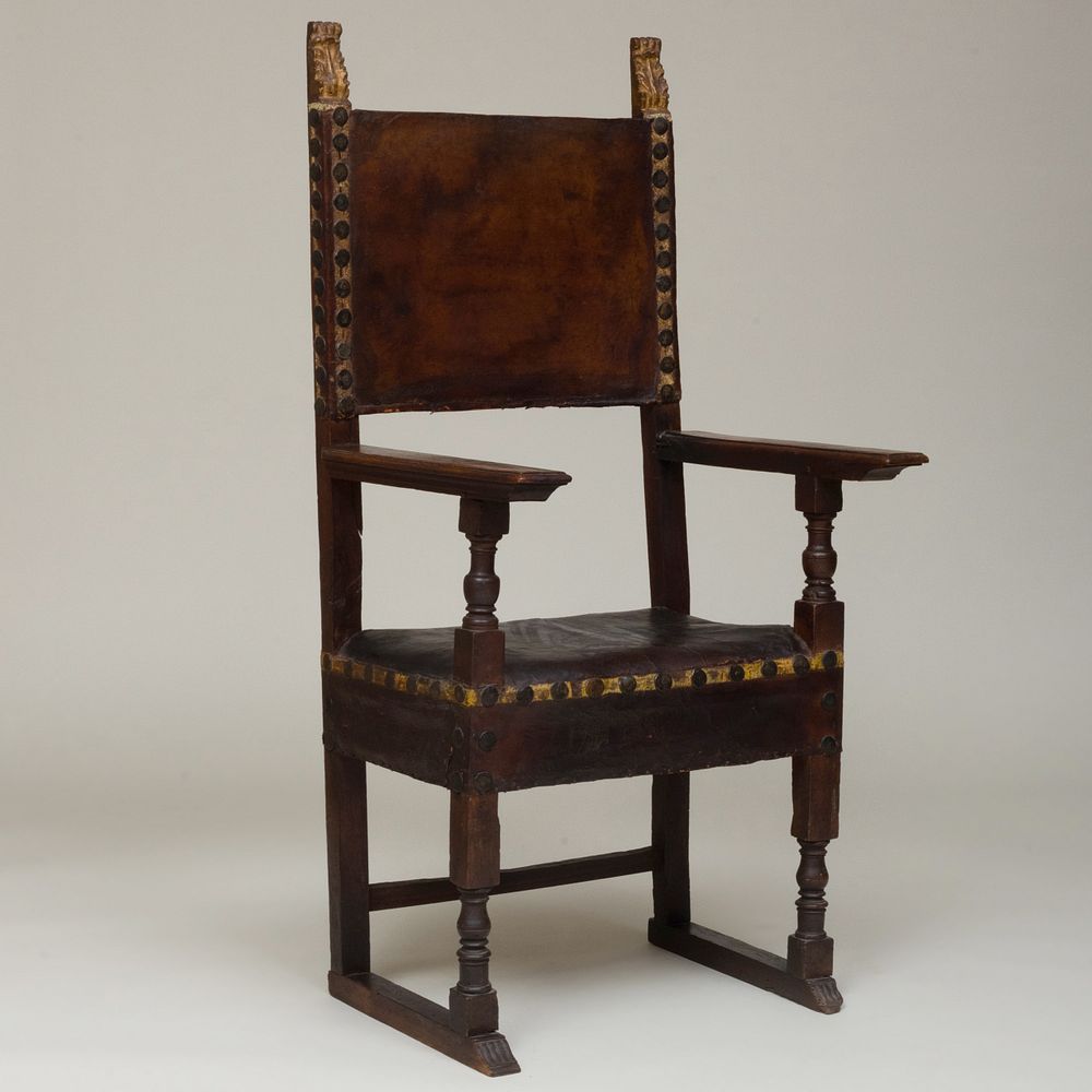 Appraisal: Italian Renaissance Style Walnut and Parcel-Gilt Armchair Upholstered in metal-mounted