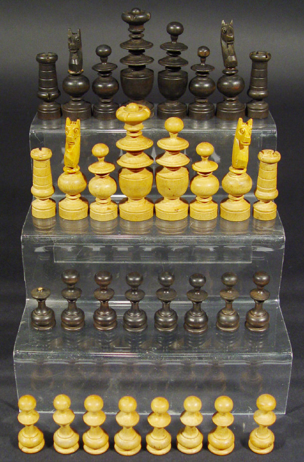 Appraisal: Stained wooden chess set in box the king cm high