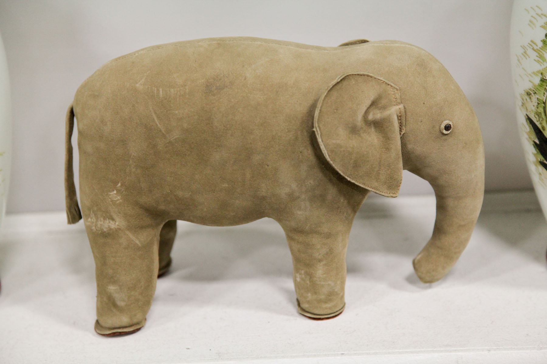 Appraisal: LEATHER ELEPHANT TOY Probably English th century Charming elephant figure