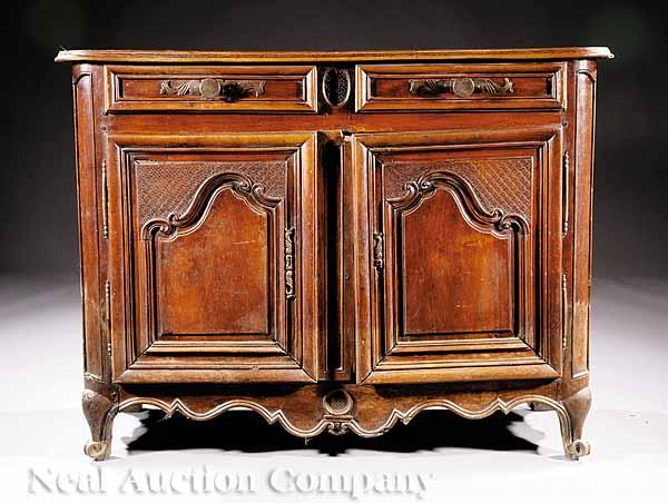 Appraisal: A Transitional Louis XVI Carved Walnut Buffet Bas th c