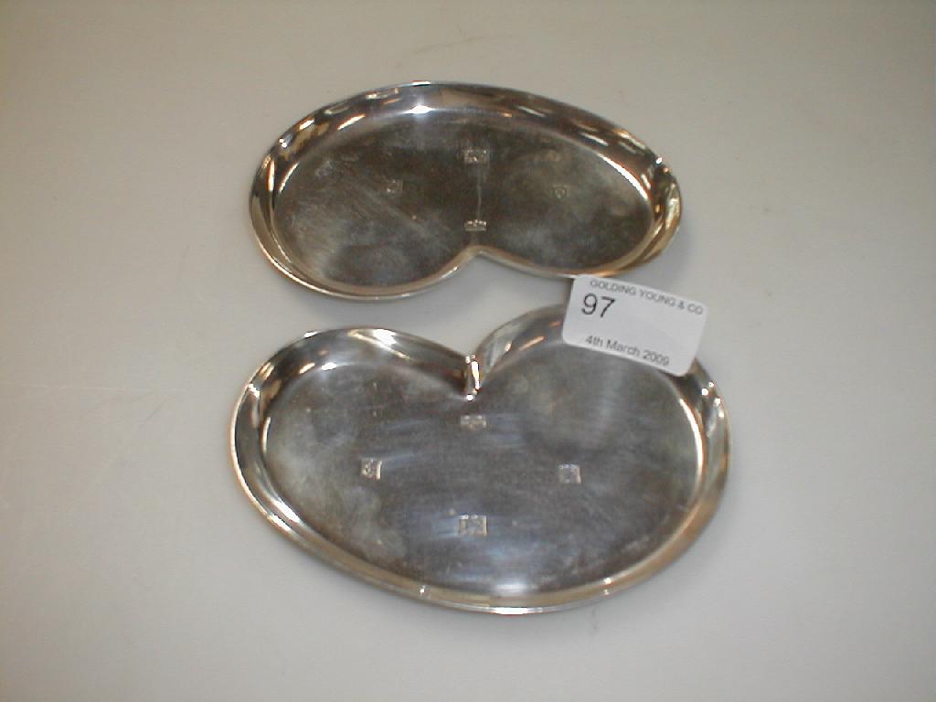 Appraisal: A pair of Mappin Webb silver pin dishes of curvilinear