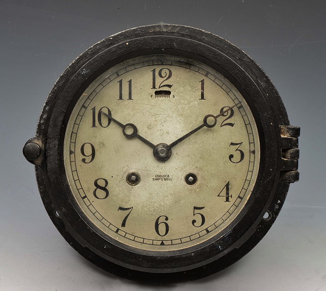 Appraisal: A CHELSEA SHIPS BELL BULK HEAD CLOCK with silvered Arabic