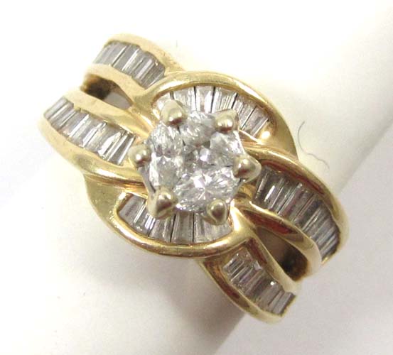 Appraisal: DIAMOND AND FOURTEEN KARAT GOLD RING centering three marquise-cut diamonds