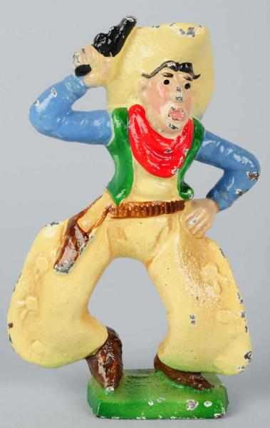 Appraisal: Cast Iron Cowboy with Six Shooter Paperweight Wilton Products Condition