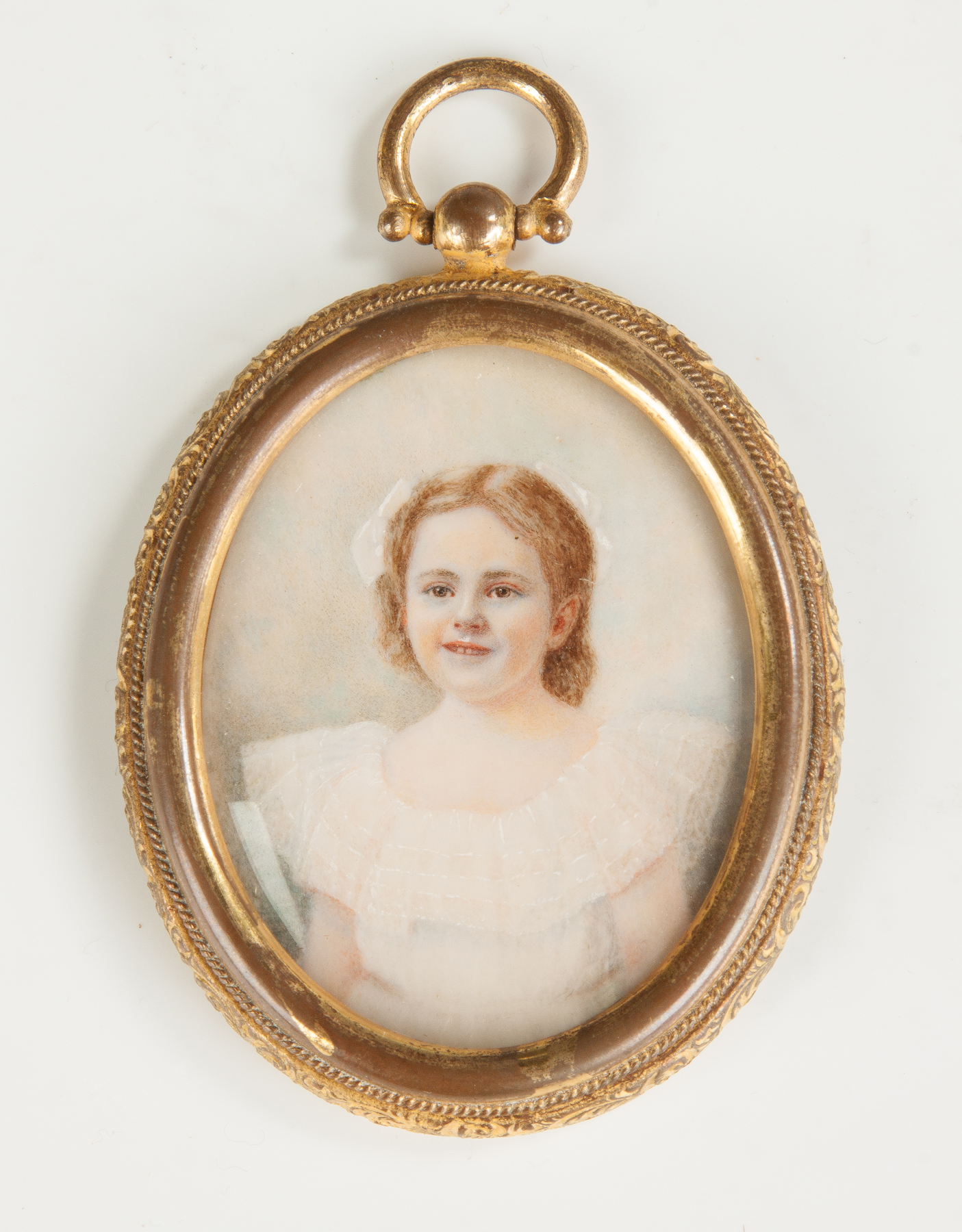 Appraisal: Miniature of a Young Girl in Engraved Brass Case Late