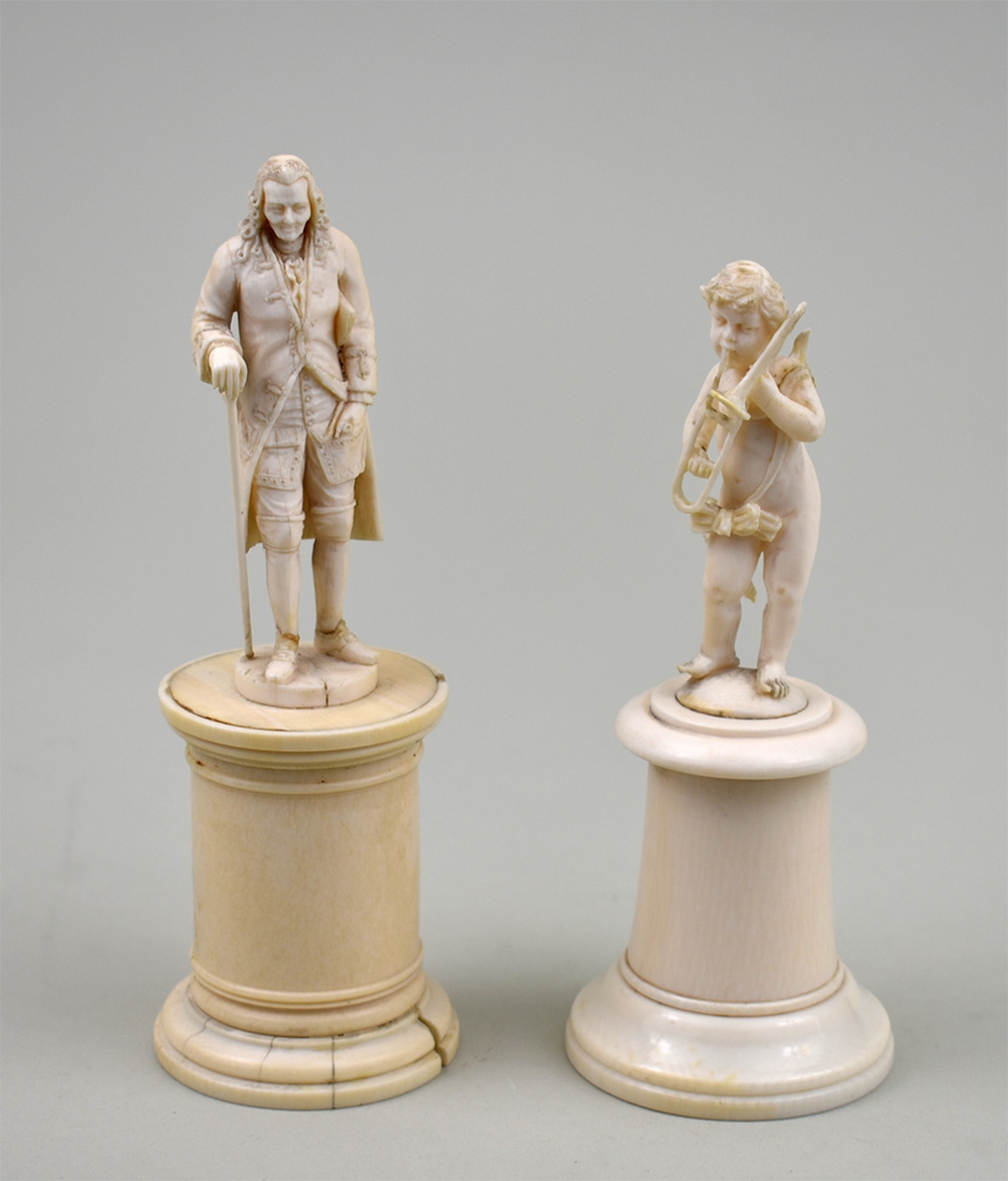 Appraisal: TWO CONTINENTAL IVORY FIGURES A GENTLEMAN AND A PUTTOBoth th