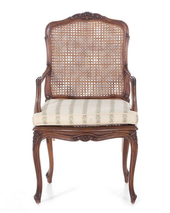 Appraisal: Louis XV style fruitwood and cane armchair BH SH W