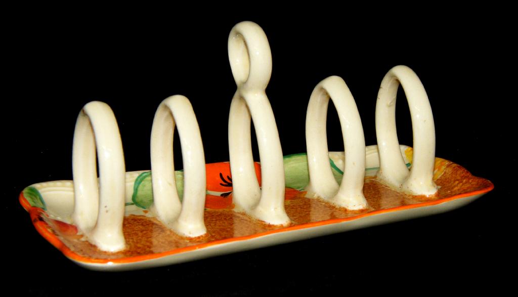 Appraisal: Nasturtium' Bizarre toast rack with five ringed divisions wide