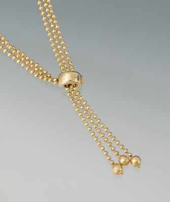 Appraisal: A Ladies' k Gold Bead Lariat Necklace Three strand k