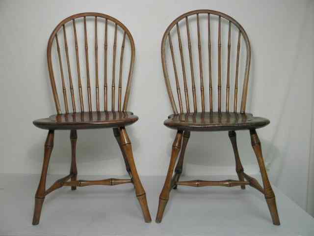 Appraisal: Pair of Windsor -spindle wooden side chairs Carved bamboo style