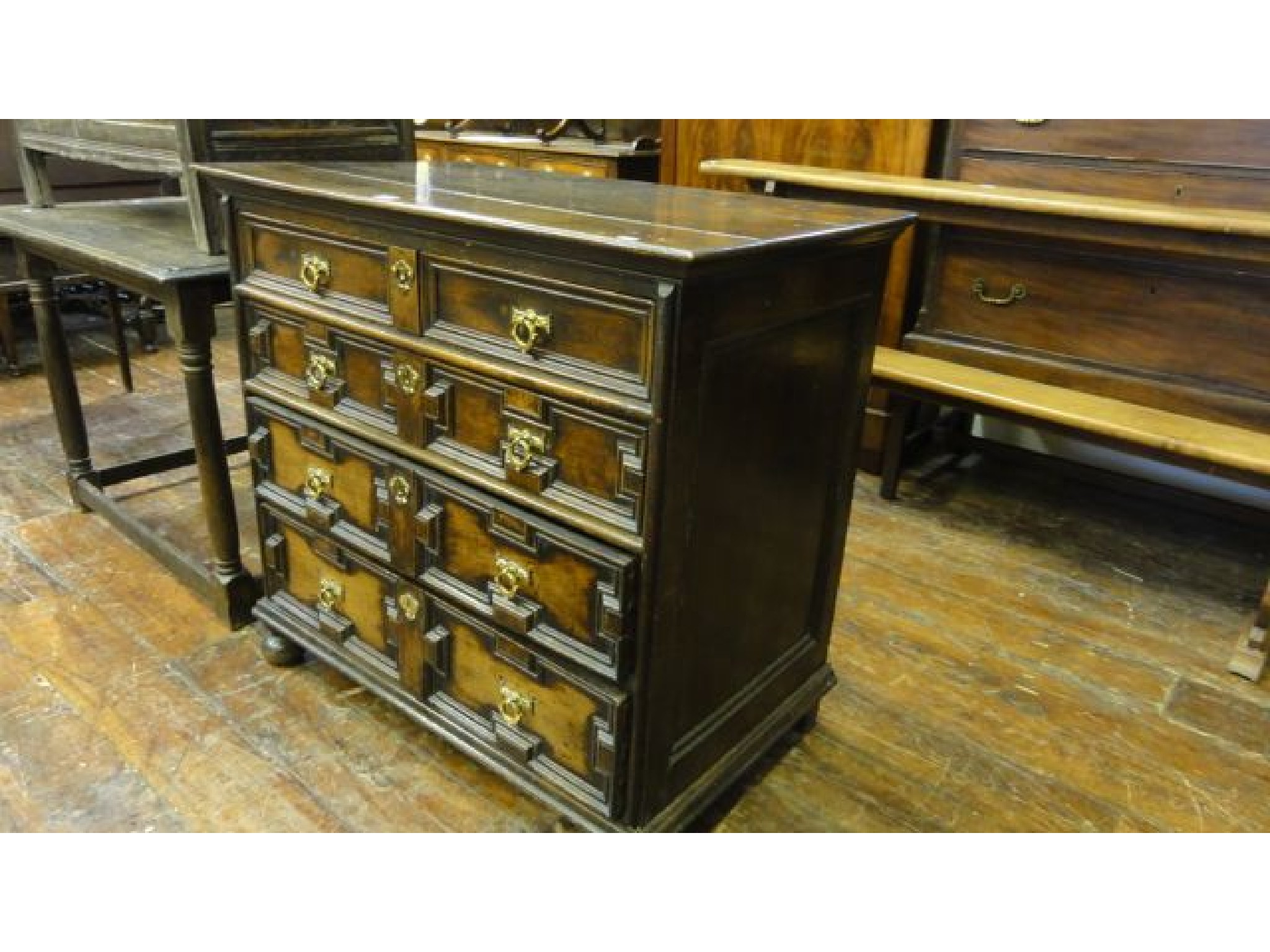 Appraisal: An early th century oak chest of four long graduated