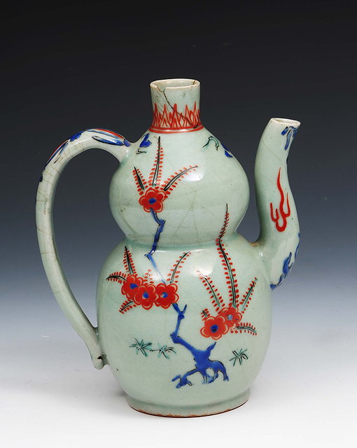 Appraisal: A Japanese Arita double gourd ewer th Centuryof celadon ground