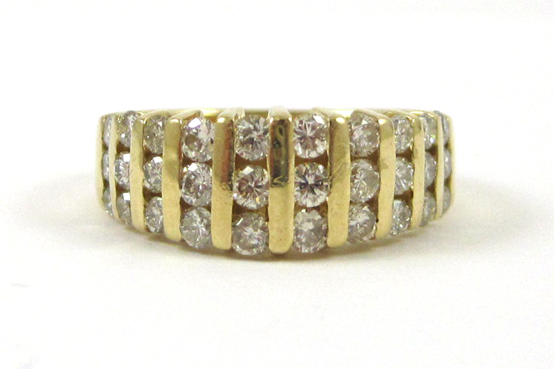 Appraisal: DIAMOND AND FOURTEEN KARAT GOLD RING set with ten rows