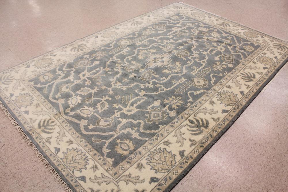 Appraisal: A CONTEMPORARY HAND KNOTTED ORIENTAL CARPET Indo-Persian overall stylized floral