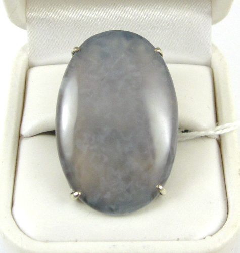 Appraisal: LAVENDER JADE AND SILVER RING featuring a large oval translucent