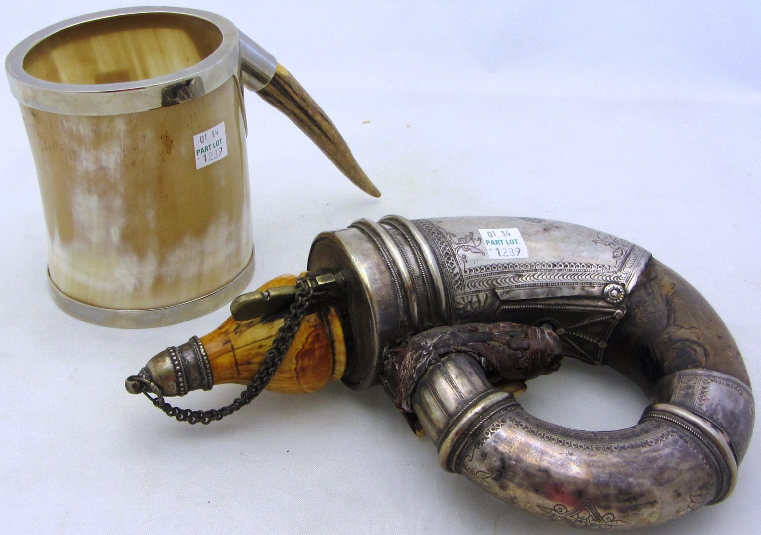 Appraisal: A Middle Eastern powder horn decorated with engraved metal panels