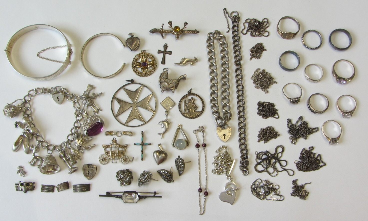 Appraisal: A collection of mostly silver jewellery comprising a charm bracelet