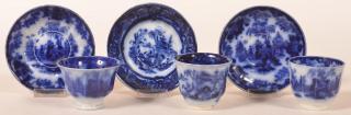 Appraisal: Flow Blue Ironstone China Cups Saucers Three Flow Blue Ironstone