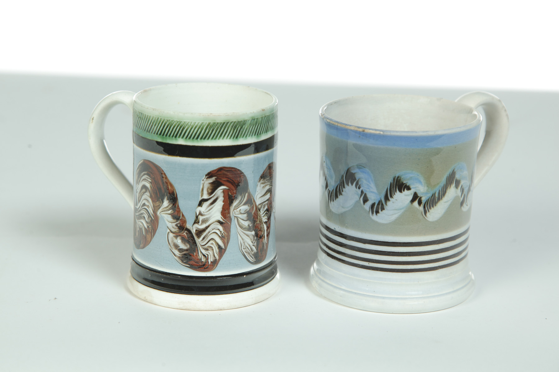 Appraisal: TWO MOCHAWARE MUGS WITH EARTHWORM DECORATION England st quarter- th