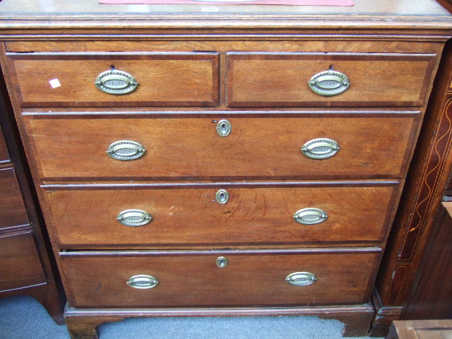 Appraisal: A George III oak chest of drawers the mahogany crossbanded