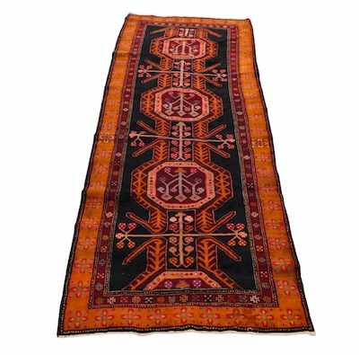 Appraisal: A Serapi Runner Vividly colored rug with wine salmon purple