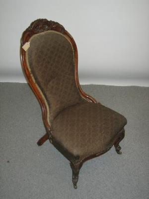 Appraisal: A VICTORIAN CARVED WALNUT FRAMED NURSING CHAIR of spoon back