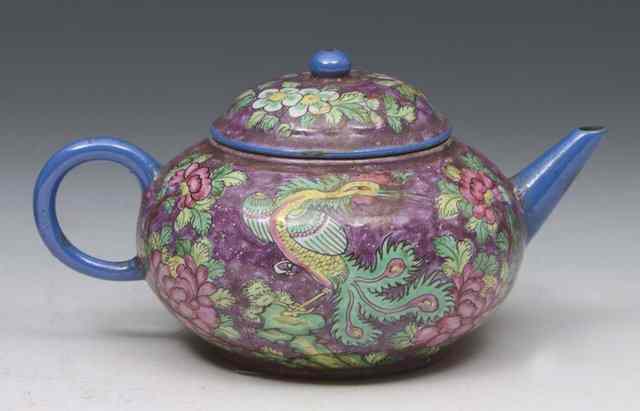 Appraisal: A YIXING SMALL CIRCULAR TEAPOT of magenta ground painted in