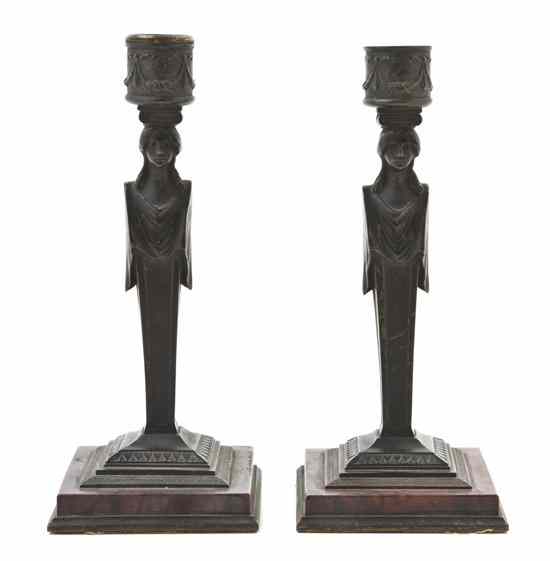 Appraisal: A Pair of Neoclassical Style Candlesticks the candle cups with