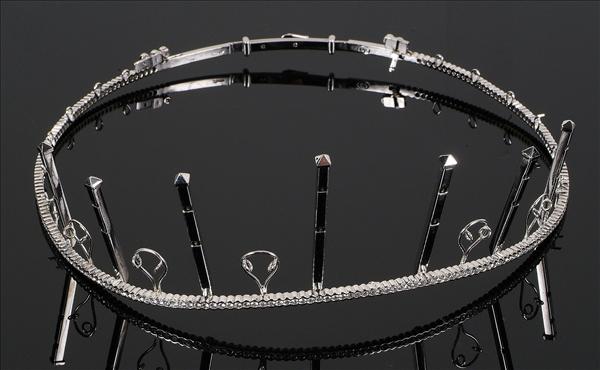 Appraisal: A diamond tiara frame by Dianoor the shaped band rub