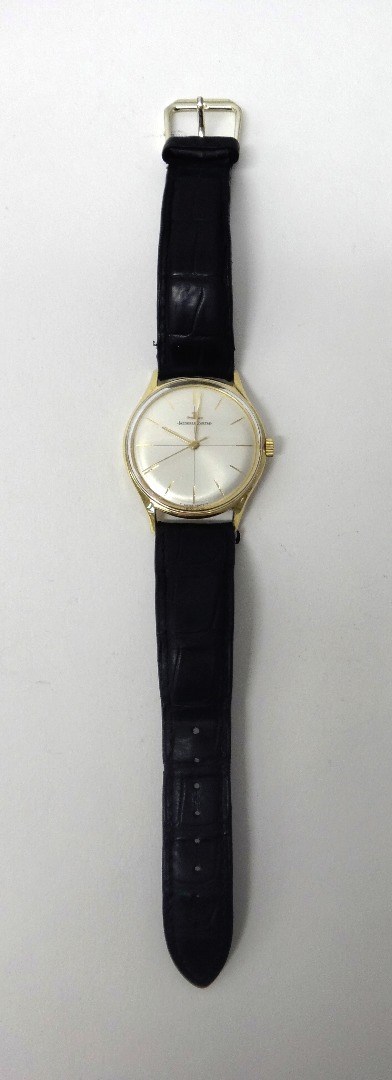 Appraisal: A gentleman's gold circular cased Jaeger Le Coultre wristwatch the