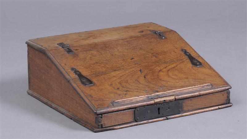 Appraisal: WROUGHT IRON-MOUNTED WALNUT TRAVELING WRITING BOX The sloping lid with