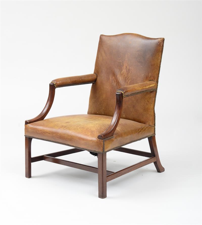 Appraisal: GEORGE III MAHOGANY LIBRARY ARMCHAIR The serpentine top rail with