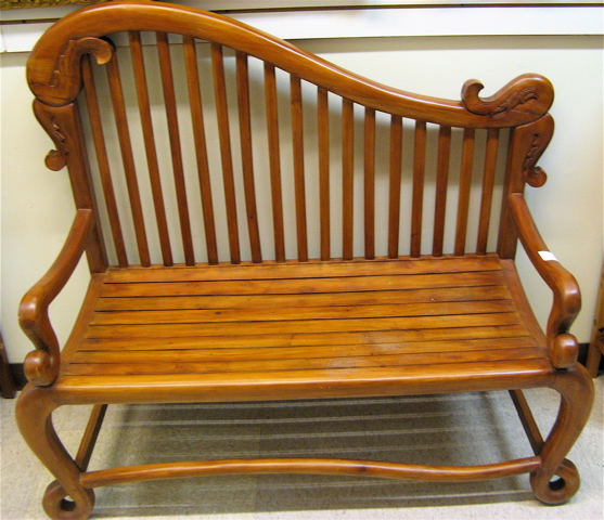 Appraisal: ART NOUVEAU STYLE TEAKWOOD SETTEE with harp-like slat back slat