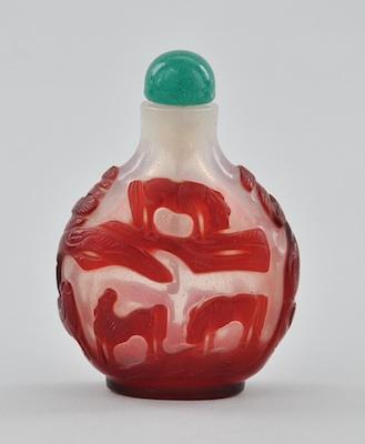 Appraisal: A Carved Glass Overlay Red Snuff Bottle Rounded shape glass