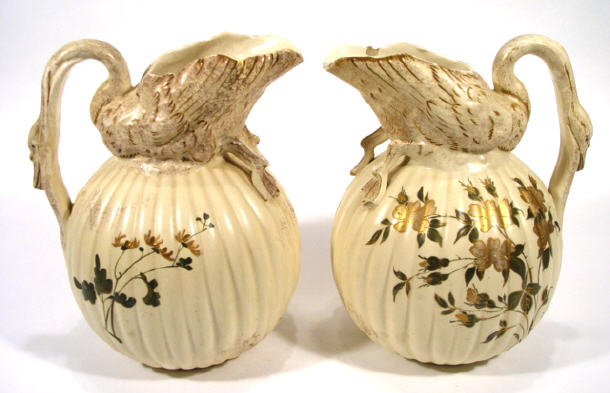 Appraisal: Large pair of globular swan necked pottery ewers with gilded