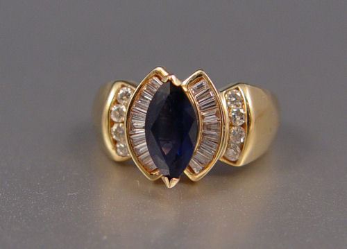 Appraisal: CT MARQUISE SAPPHIRE RING WITH DIAMONDS K yellow gold ring