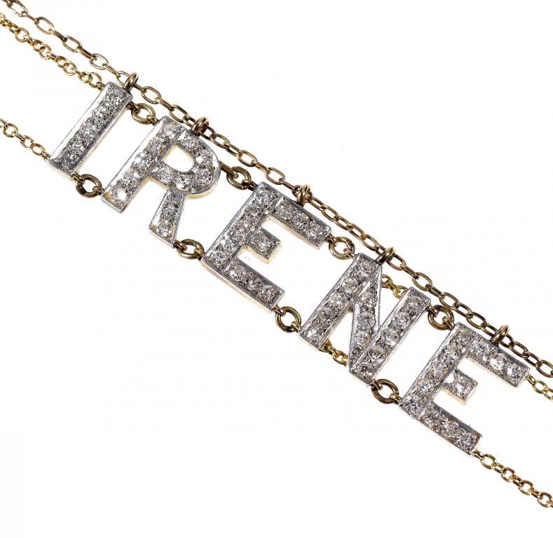 Appraisal: A DIAMOND PLATINUM AND GOLD NAME BRACELET the diamond letters