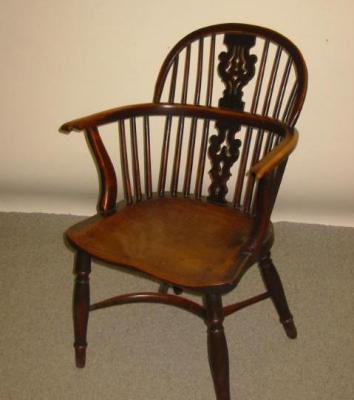 Appraisal: A YEW AND ELM WINDSOR ARMCHAIR early to mid th