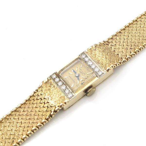 Appraisal: A ladies diamond and k gold mesh bracelet wristwatch Patek