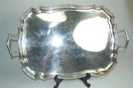 Appraisal: A modern twin handled butlers tray retailed by F J