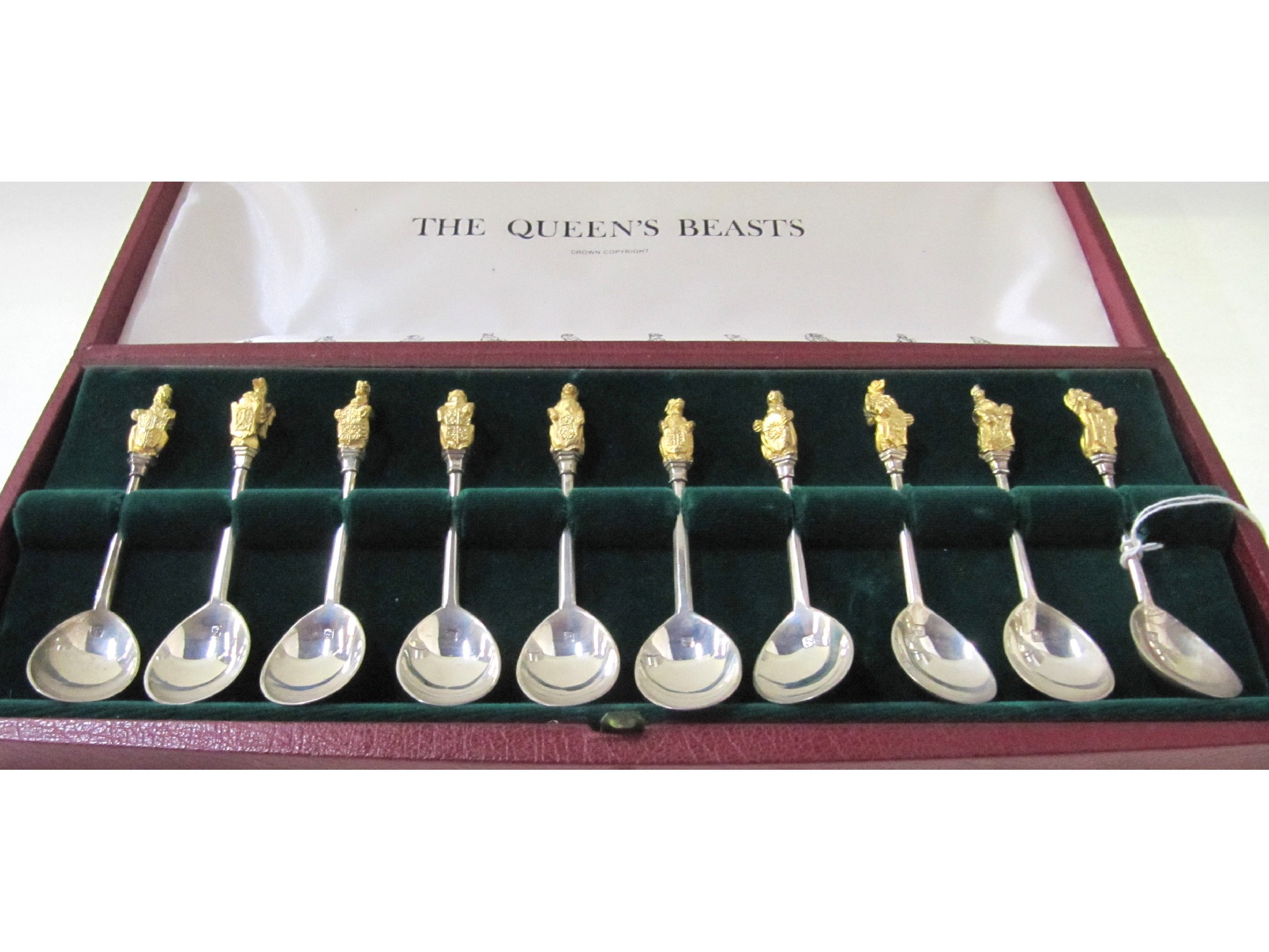 Appraisal: A cased set of ten silver spoons with gilt finials