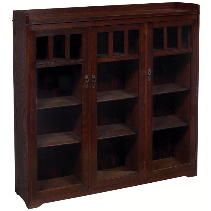 Appraisal: Lifetime bookcase three-door form with divided glass panels at top