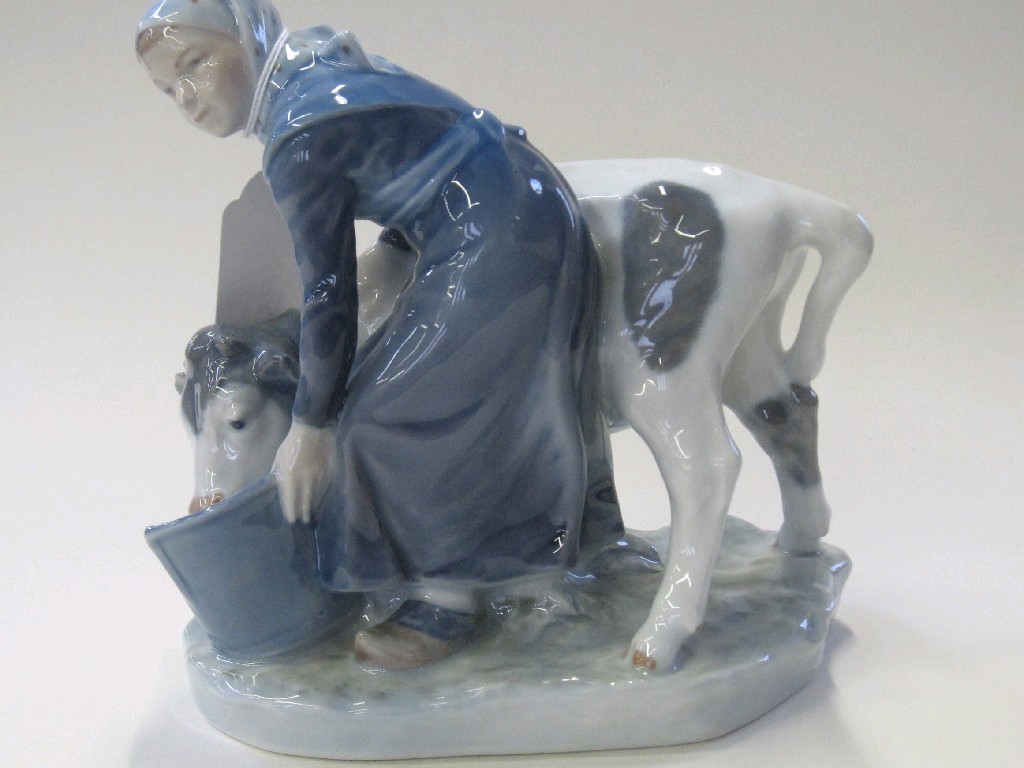 Appraisal: Royal Copenhagen figure of a milkmaid with her cow