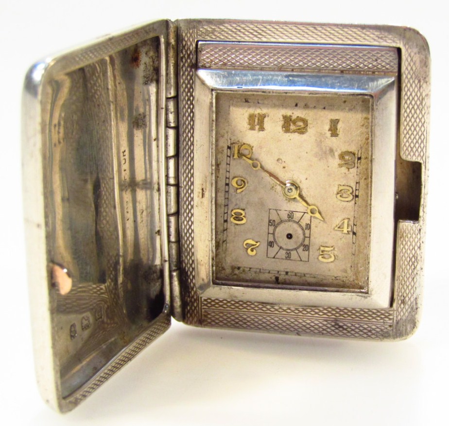 Appraisal: A George V silver travel clock the rectangular dial with