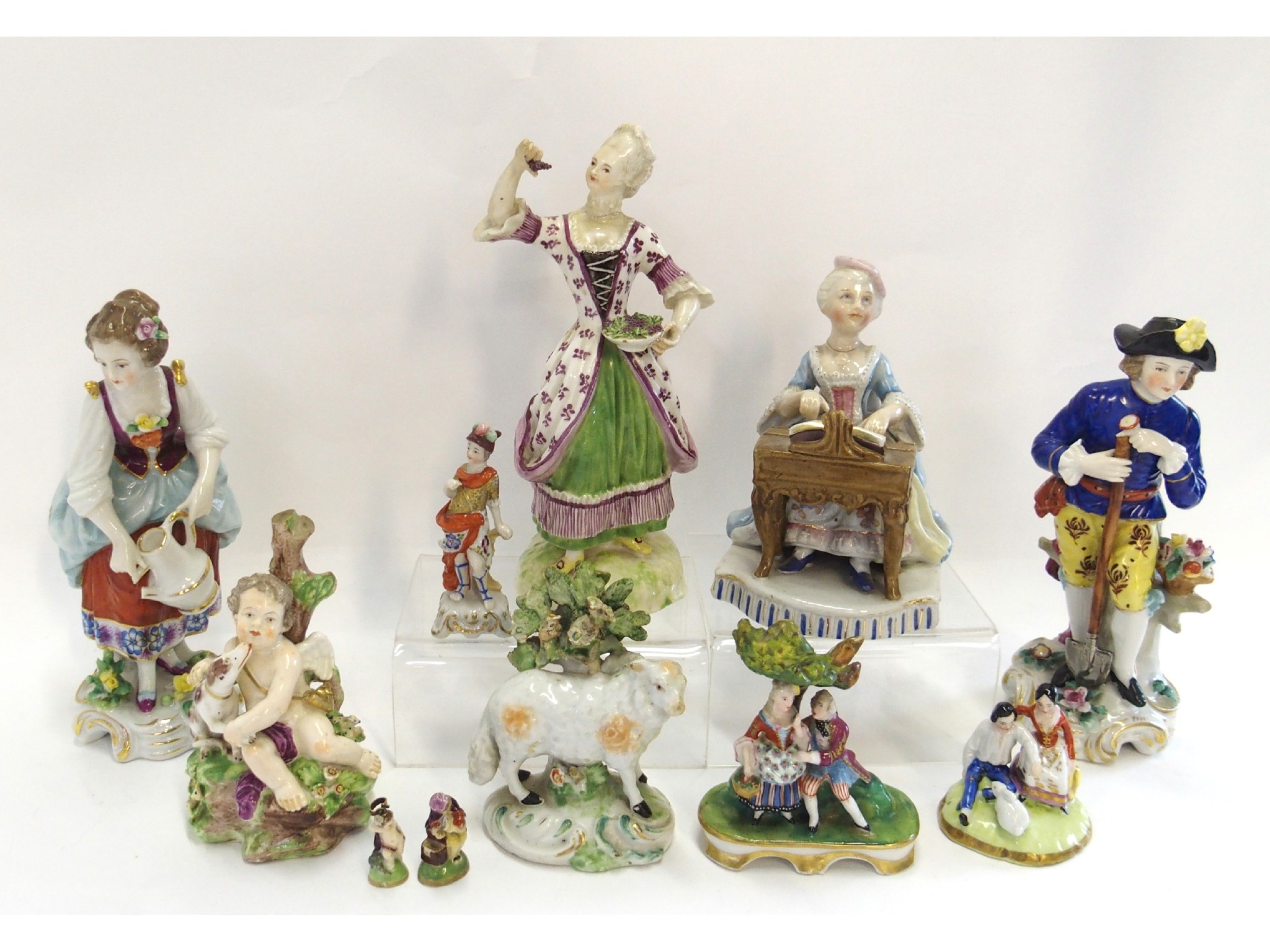 Appraisal: Assorted continental figures including a gardener lady playing a harpsichord